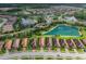 Aerial view showcases the community's lush landscaping and beautiful lakes at 11611 Callisia Dr, Odessa, FL 33556