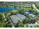Overhead shot of tennis courts, playground, and lake in a beautiful community at 11611 Callisia Dr, Odessa, FL 33556