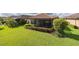 Scenic backyard view featuring lush greenery and a screened lanai for outdoor enjoyment at 11611 Callisia Dr, Odessa, FL 33556