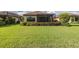 Spacious backyard featuring a screened lanai and lush landscaping for outdoor enjoyment at 11611 Callisia Dr, Odessa, FL 33556