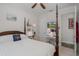 This bedroom features a four poster bed, a study area, and an adjacent bathroom at 11611 Callisia Dr, Odessa, FL 33556