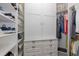 This walk-in closet has built-in shelving and drawers for organization and ample storage space at 11611 Callisia Dr, Odessa, FL 33556