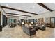 Large clubhouse interior with tiled floors, beamed ceilings, sofas and tables for community gatherings at 11611 Callisia Dr, Odessa, FL 33556