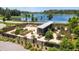 Community garden with raised garden beds and lake view in a well-maintained neighborhood at 11611 Callisia Dr, Odessa, FL 33556