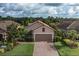 Charming single-story home with a well-manicured lawn and attractive landscaping at 11611 Callisia Dr, Odessa, FL 33556