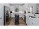 Bright kitchen with white cabinets, stainless steel appliances, and a butcher block island, great for cooking at 11611 Callisia Dr, Odessa, FL 33556
