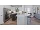 Modern kitchen with stainless steel appliances, a breakfast bar, and an open layout, perfect for cooking at 11611 Callisia Dr, Odessa, FL 33556