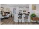 Open-concept kitchen with bar seating overlooking the dining area, creating a seamless living space at 11611 Callisia Dr, Odessa, FL 33556