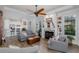Spacious living room featuring a fireplace, built-in bookshelves, and an open-concept design at 11611 Callisia Dr, Odessa, FL 33556
