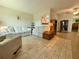 Inviting living room featuring tile floors and comfortable seating, perfect for relaxation at 11911 Bayonet Ln, New Port Richey, FL 34654