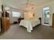 Spacious main bedroom features a ceiling fan and view to the Primary bath at 11911 Bayonet Ln, New Port Richey, FL 34654