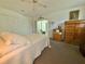 Comfortable main bedroom features a ceiling fan and multiple closets at 11911 Bayonet Ln, New Port Richey, FL 34654