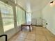 Sunroom featuring a washing machine, dryer and tile floors at 11911 Bayonet Ln, New Port Richey, FL 34654