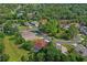 Beautiful aerial shot of a residential area, featuring lush greenery, mature trees, and well-kept homes at 12071 Wexford Blvd, Spring Hill, FL 34609