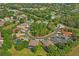 Aerial view of a beautiful neighborhood surrounded by lush greenery and manicured lawns at 12071 Wexford Blvd, Spring Hill, FL 34609