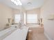 Spacious bathroom boasts double sinks, a soaking tub, and neutral tile at 12071 Wexford Blvd, Spring Hill, FL 34609