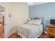 Bedroom with bed and wood floors at 12071 Wexford Blvd, Spring Hill, FL 34609