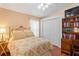 Comfortable bedroom featuring a double bed, closet, and desk at 12071 Wexford Blvd, Spring Hill, FL 34609