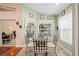 The breakfast nook features a glass table and large windows providing plenty of natural light at 12071 Wexford Blvd, Spring Hill, FL 34609