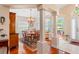 Elegant dining room with decorative columns, wood floors, and a chandelier at 12071 Wexford Blvd, Spring Hill, FL 34609