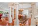 The dining room is open to other living spaces and features wood floors and natural light at 12071 Wexford Blvd, Spring Hill, FL 34609