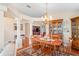The dining room is perfect for gatherings, with stylish decor and an open flow to living spaces at 12071 Wexford Blvd, Spring Hill, FL 34609