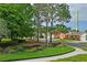 Well-maintained landscaping with an American flag waving in a quiet neighborhood at 12071 Wexford Blvd, Spring Hill, FL 34609