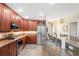 Spacious kitchen with granite countertops, stainless steel appliances, and wooden cabinets at 12071 Wexford Blvd, Spring Hill, FL 34609