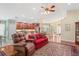 Open living space with hardwood floors, a view of the kitchen, and natural light at 12071 Wexford Blvd, Spring Hill, FL 34609