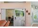Sunroom with tile floor, sliding door and chairs at 12071 Wexford Blvd, Spring Hill, FL 34609