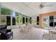 Sunroom features lots of sunlight, seating and tile floor at 12071 Wexford Blvd, Spring Hill, FL 34609