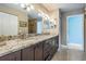 Bathroom featuring double sinks, granite countertops, and modern fixtures at 1222 Starboard Ky, Tarpon Springs, FL 34689