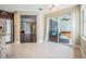 Open-concept living area featuring a modern kitchen and sliding glass doors to the outdoor patio at 1222 Starboard Ky, Tarpon Springs, FL 34689