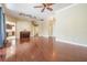 Large living room featuring wood floors, high ceilings, and seamless access to the kitchen at 1222 Starboard Ky, Tarpon Springs, FL 34689
