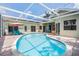Serene screened-in pool area with ample patio space, perfect for outdoor relaxation and entertainment at 1222 Starboard Ky, Tarpon Springs, FL 34689
