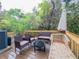Enjoy a relaxing experience on this deck with outdoor seating amidst a lush backdrop, perfect for entertaining at 12408 Country White Cir, Tampa, FL 33635