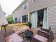 View of an outdoor wooden deck featuring stylish wicker furniture and a cozy fire pit, perfect for relaxing at 12408 Country White Cir, Tampa, FL 33635