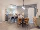 Charming dining area with a stylish table and chairs adjacent to a modern kitchen, offering a seamless dining experience at 12408 Country White Cir, Tampa, FL 33635