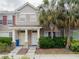 Townhome exterior with beige siding, white trim, and two front doors at 12408 Country White Cir, Tampa, FL 33635