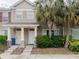 Charming townhome with manicured landscaping and welcoming entrance featuring a stone facade and freshly painted doors at 12408 Country White Cir, Tampa, FL 33635