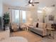 Bright living room featuring neutral tones, comfortable seating, large windows, and stylish decor, perfect for relaxation at 12408 Country White Cir, Tampa, FL 33635