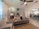 Inviting living room with neutral tones, ceiling fan, and easy access to the kitchen at 12408 Country White Cir, Tampa, FL 33635