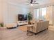 Stylish living room showcasing a modern design, sleek furniture, a large TV, and an inviting atmosphere for entertainment at 12408 Country White Cir, Tampa, FL 33635
