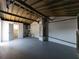 Large garage/storage area with potential for various uses, featuring a bathroom with marble-style tiles at 1249 Honor Dr, Holiday, FL 34690