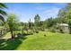 Lush backyard with garden beds and a charming garden shed at 1253 Culbreath Rd, Brooksville, FL 34602