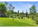 Large, grassy backyard with a wooden fence, ideal for outdoor activities and privacy at 1253 Culbreath Rd, Brooksville, FL 34602