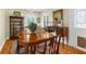 Formal dining room featuring a wooden table, traditional decor, and natural light at 1253 Culbreath Rd, Brooksville, FL 34602