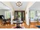 Elegant foyer with chandelier, hardwood floors, and a decorative table creates a grand entrance at 1253 Culbreath Rd, Brooksville, FL 34602