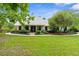 Charming single story home with manicured landscaping and a metal roof at 1253 Culbreath Rd, Brooksville, FL 34602