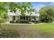 Charming two-story home with landscaped front yard and metal roof provides curb appeal and a welcoming entrance at 1253 Culbreath Rd, Brooksville, FL 34602